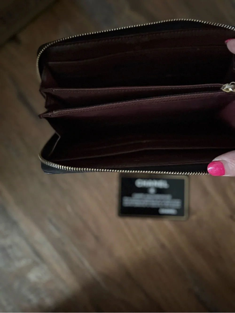 CHANEL Black Quilted Zip Around Wallet with Gold CC